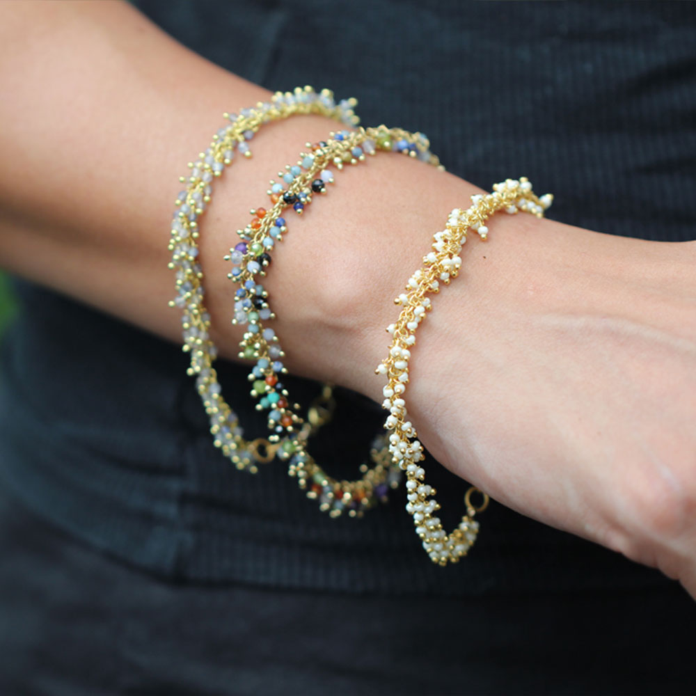 Fringe Bracelets stacked in Labradorite, Multi-Gemstone and Pearl, gold plated, lifestyle shot