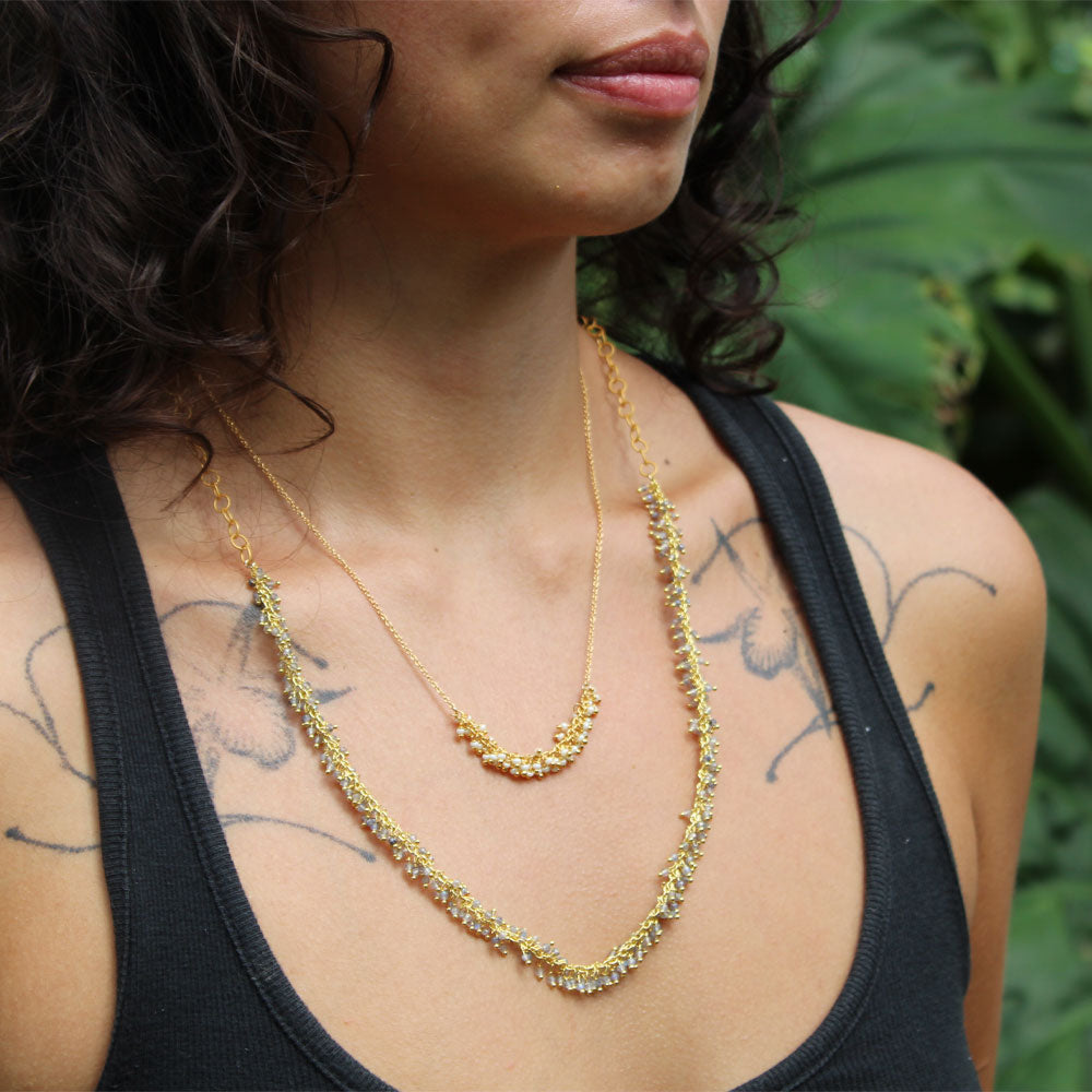 Long Fringe Necklace in Labradorite layered with Short Horizontal Fringe Necklace in Pearl, gold plated, lifestyle shot